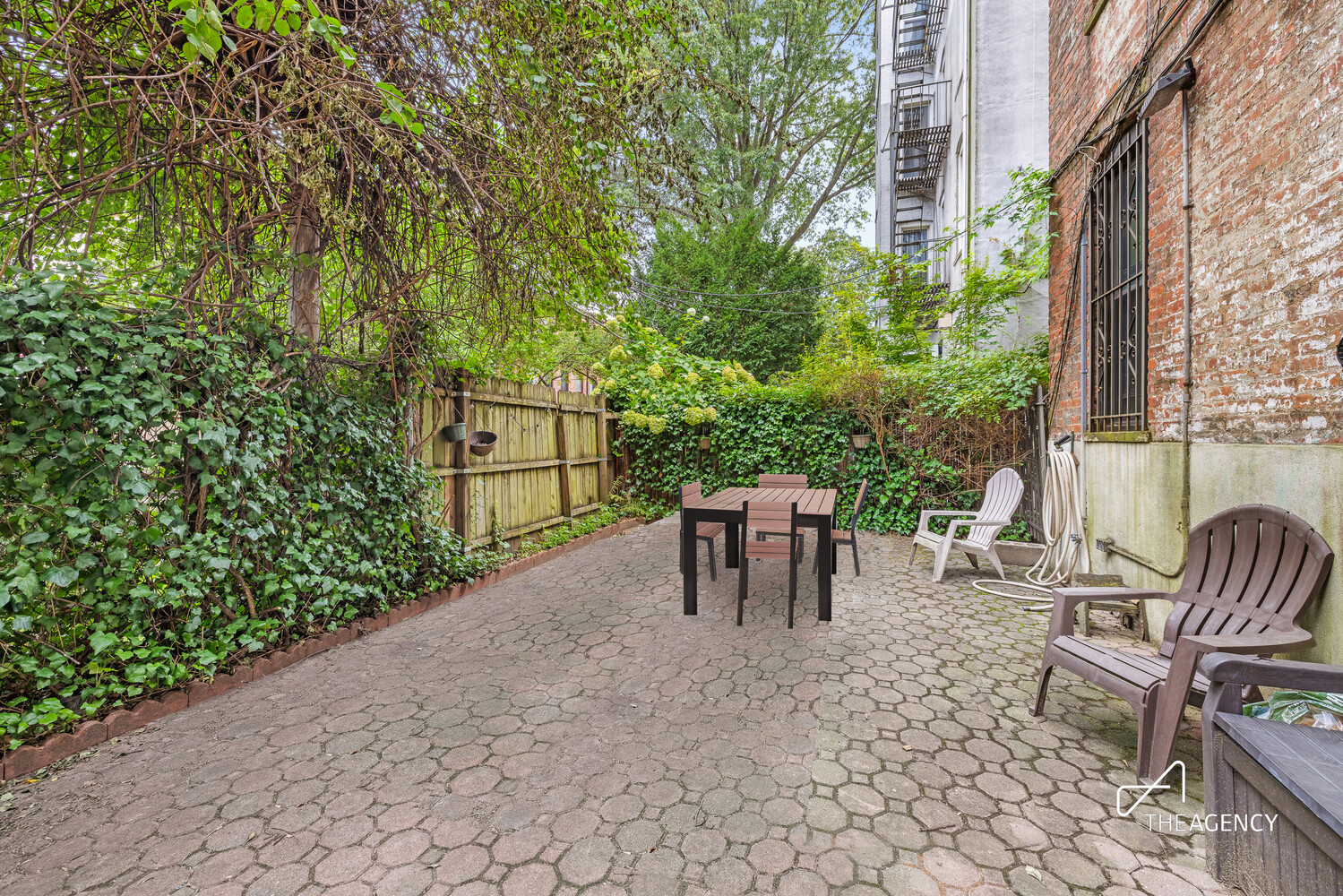 423 15th Street, Unit 2B Brooklyn, NY 11215 - Photo 8 of 10 a view of a patio with table and chairs and potted plants