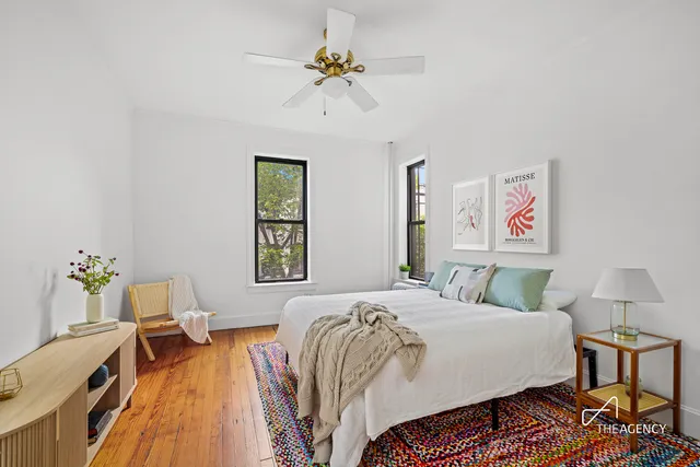 a view of a patio with table and chairs and potted plants