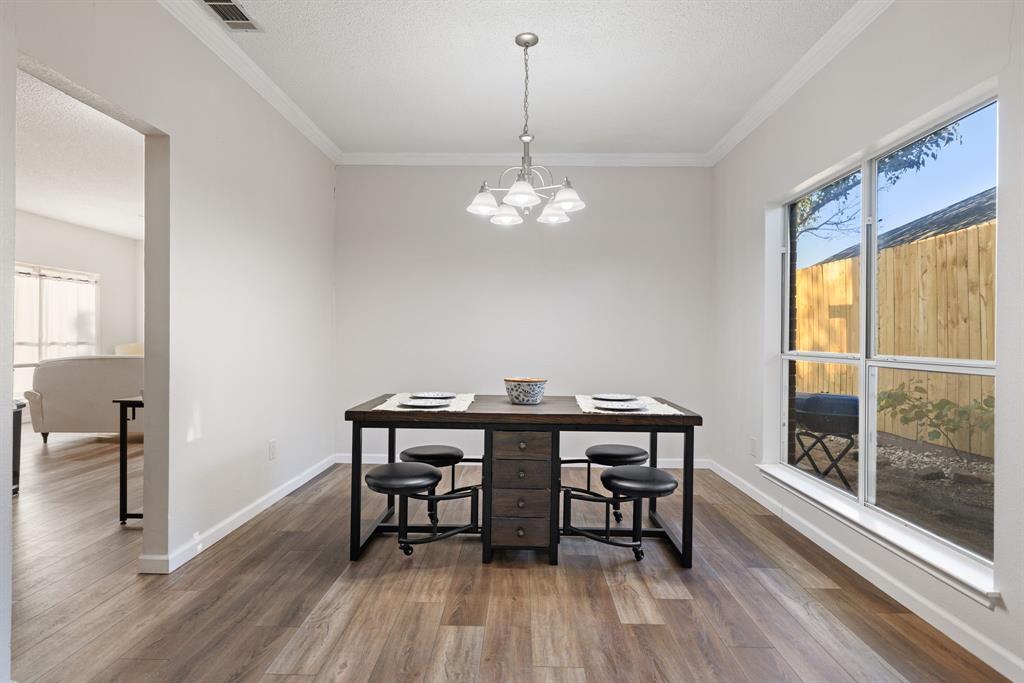 750 Pulitzer Lane Allen, TX 75002 - Photo 12 of 40 a view of a dining room with furniture window and wooden floor