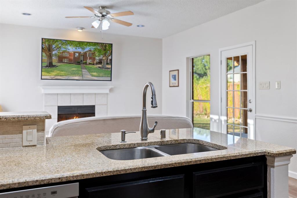 750 Pulitzer Lane Allen, TX 75002 - Photo 15 of 40 a kitchen with a sink and a window