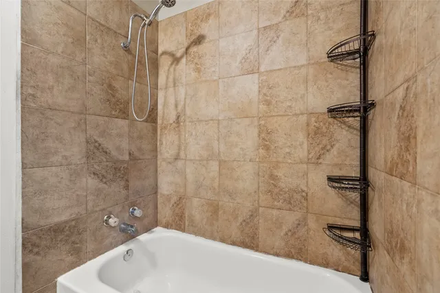 a bathroom with a sink and shower