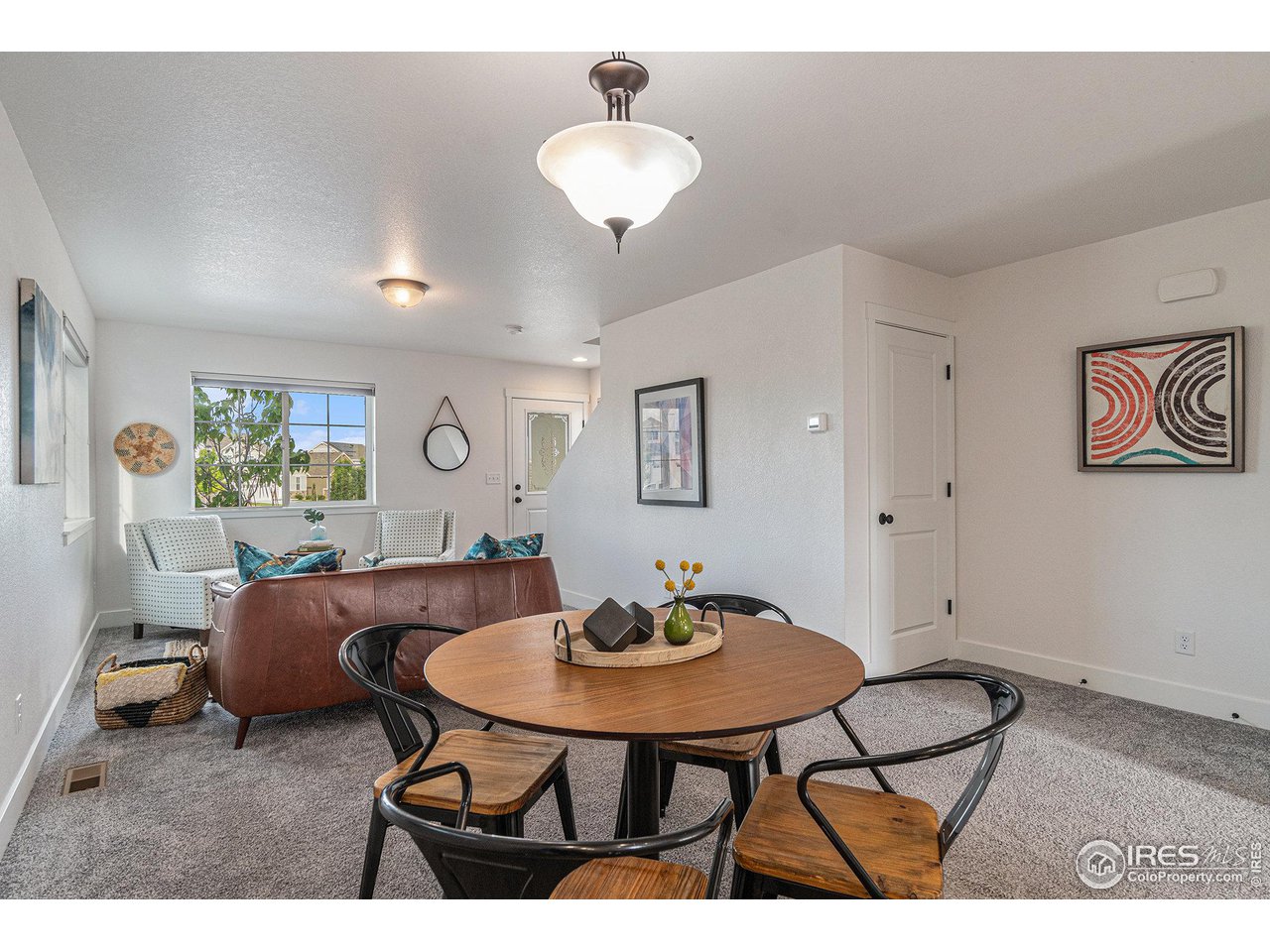 2771 Red Wheat Trail Berthoud, CO 80513 - Photo 13 of 24 a living room with furniture and a table