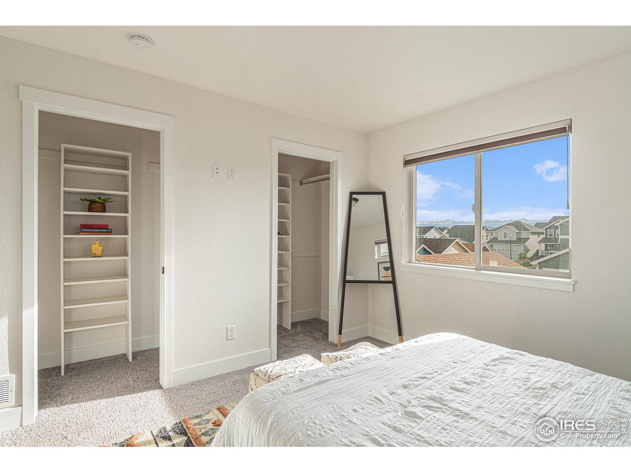 2771 Red Wheat Trail Berthoud, CO 80513 - Photo 18 of 24 a bedroom with a bed and a window
