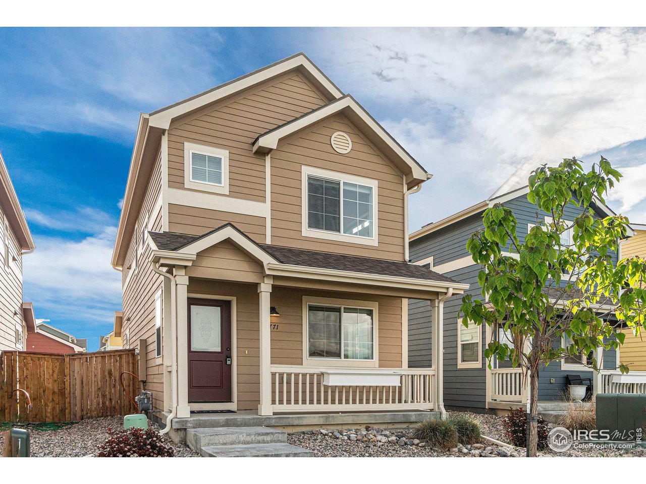 2771 Red Wheat Trail Berthoud, CO 80513 - Photo 2 of 24 a front view of a house with a yard