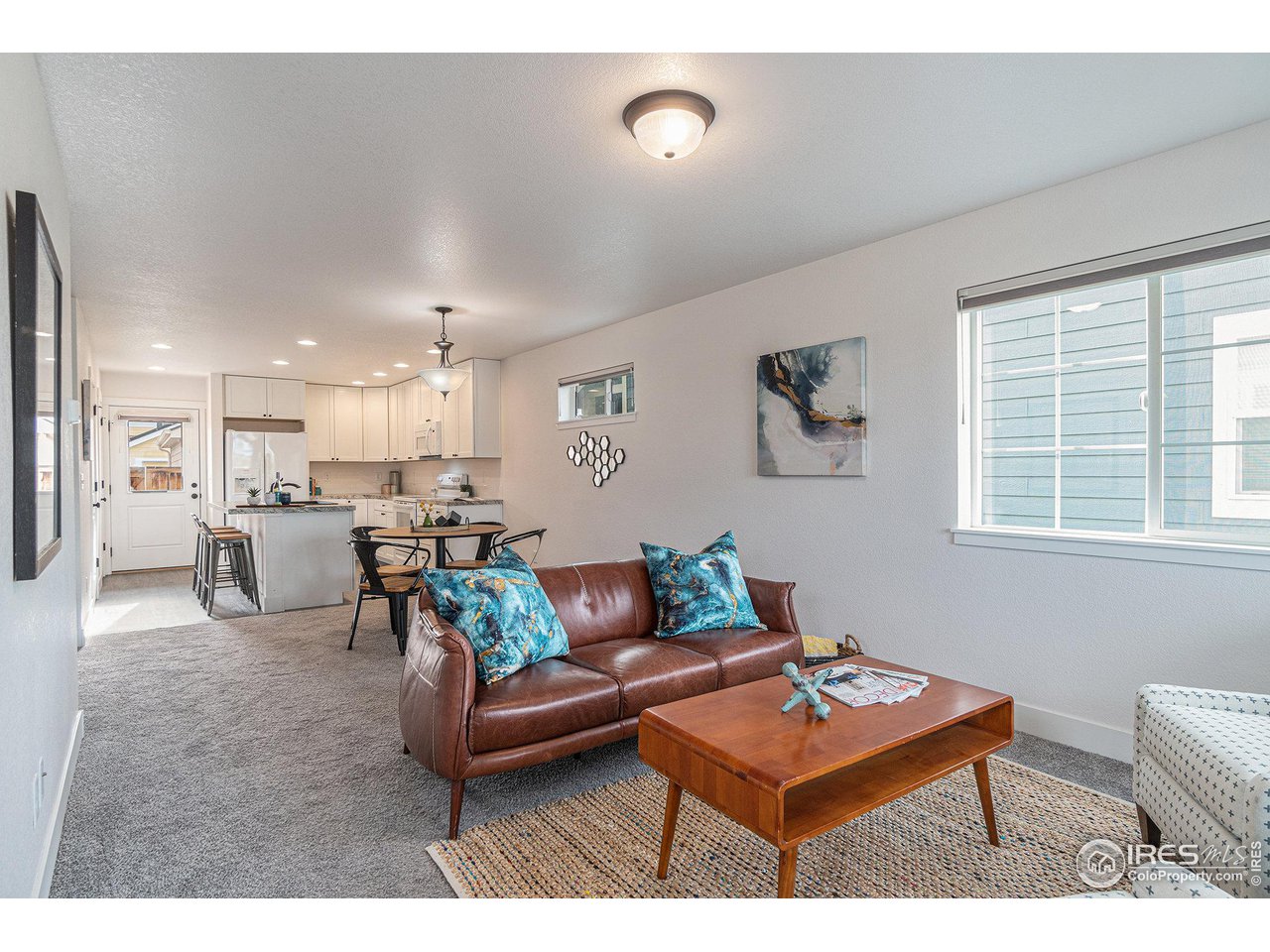 2771 Red Wheat Trail Berthoud, CO 80513 - Photo 4 of 24 a living room with furniture and a table
