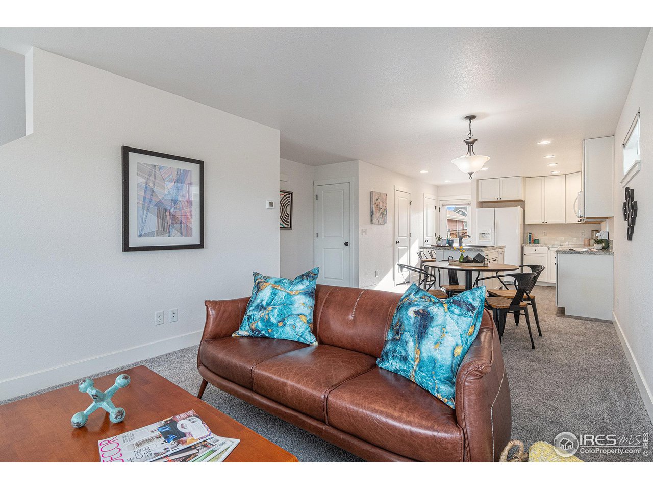 2771 Red Wheat Trail Berthoud, CO 80513 - Photo 5 of 24 a living room with furniture and kitchen view