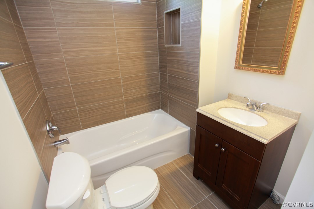 6729 Strathmore Road North Chesterfield, VA 23237 - Photo 20 of 30 a bathroom with a sink a toilet and bathtub