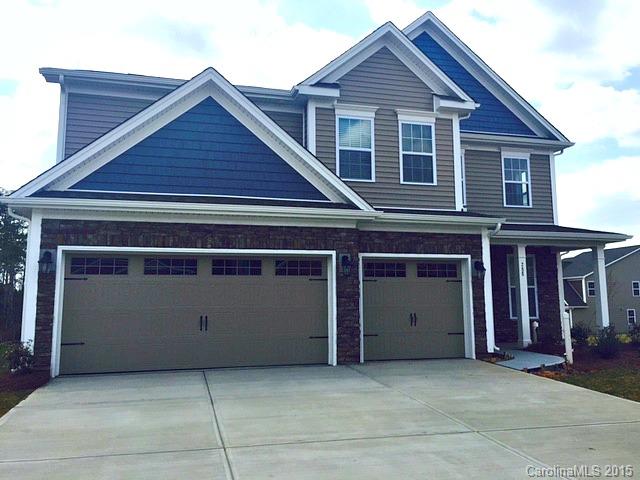 1834 Larkspur Way, Unit 203 Tega Cay, SC 29708 - Photo 1 of 24 a front view of a house with garage