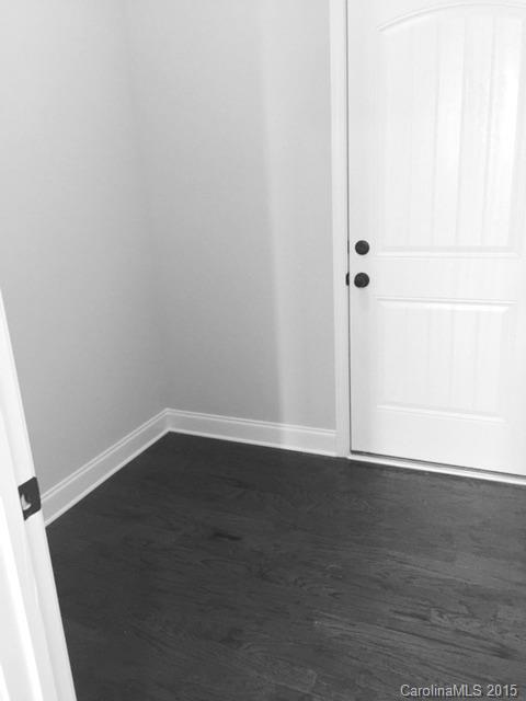 1834 Larkspur Way, Unit 203 Tega Cay, SC 29708 - Photo 11 of 24 a view of an empty room with wooden floor