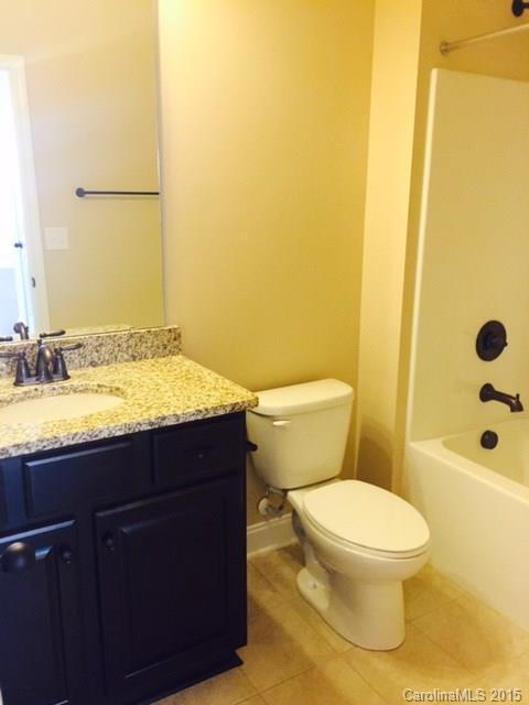 1834 Larkspur Way, Unit 203 Tega Cay, SC 29708 - Photo 3 of 24 a bathroom with a sink and a toilet