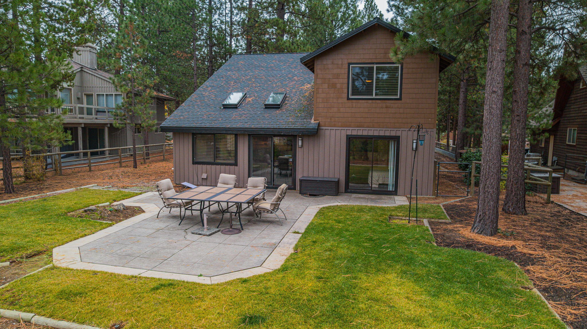 56019 Snow Goose Road Bend, OR 97707 - Photo 10 of 32 a view of a house with a yard patio and a patio