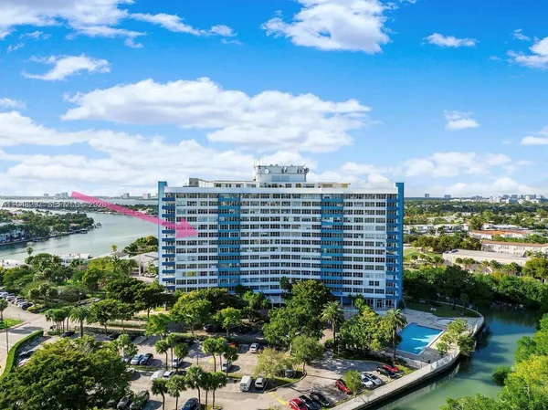 a view of a lake with a city skyline in the background