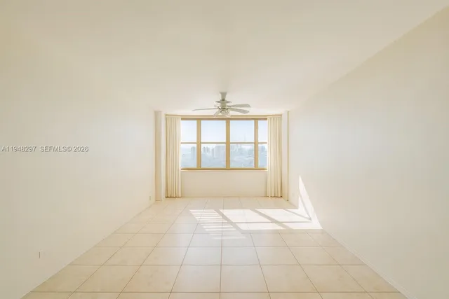 a view of an empty room and window