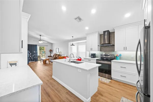 a kitchen that has a lot of cabinets in it