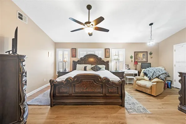 a bedroom with bed and window