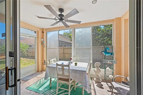 a dining room with furniture mountain view and a floor to ceiling window