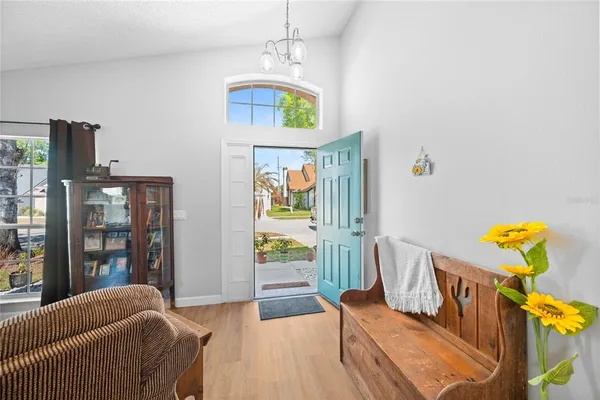 a bedroom with furniture and a window