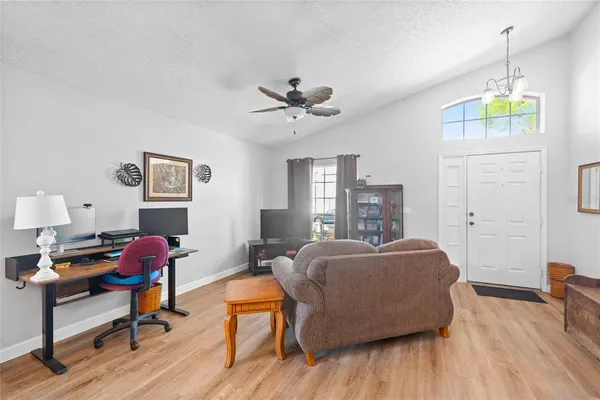 a bedroom with furniture and a wooden floor