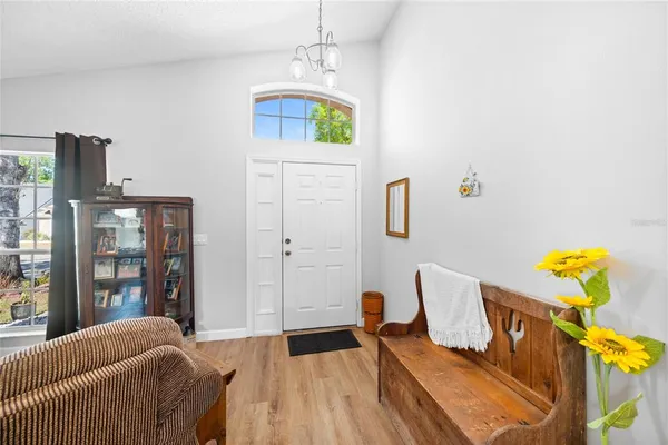 a bedroom with furniture and a window