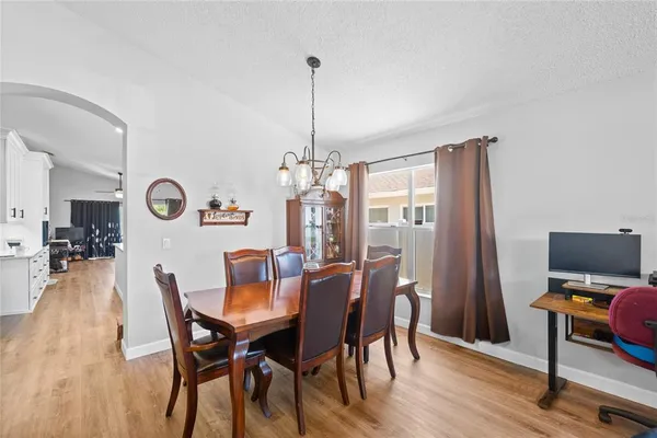 a dining room with furniture and window