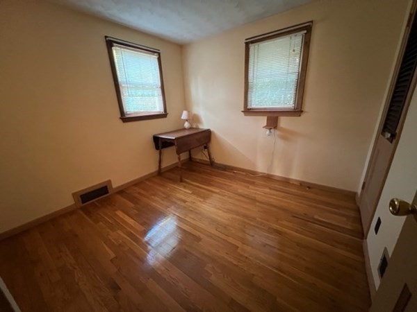 115 Forest Street Danvers, MA 01923 - Photo 14 of 19 a view of a room with wooden floor and windows