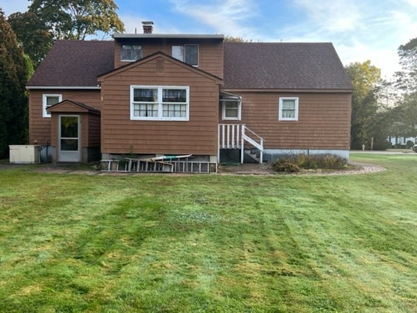 115 Forest Street Danvers, MA 01923 - Photo 4 of 19 a front view of a house with garden