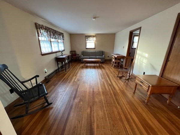 115 Forest Street Danvers, MA 01923 - Photo 6 of 19 a living room with furniture and a wooden floor