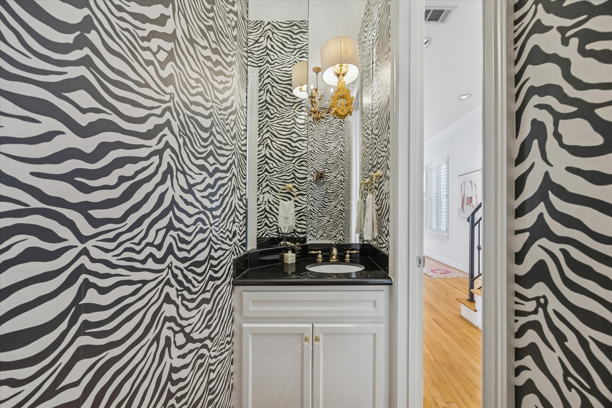 2700 Wroxton Road West University Place, TX 77005 - Photo 17 of 32 a bathroom with a granite countertop sink and a mirror