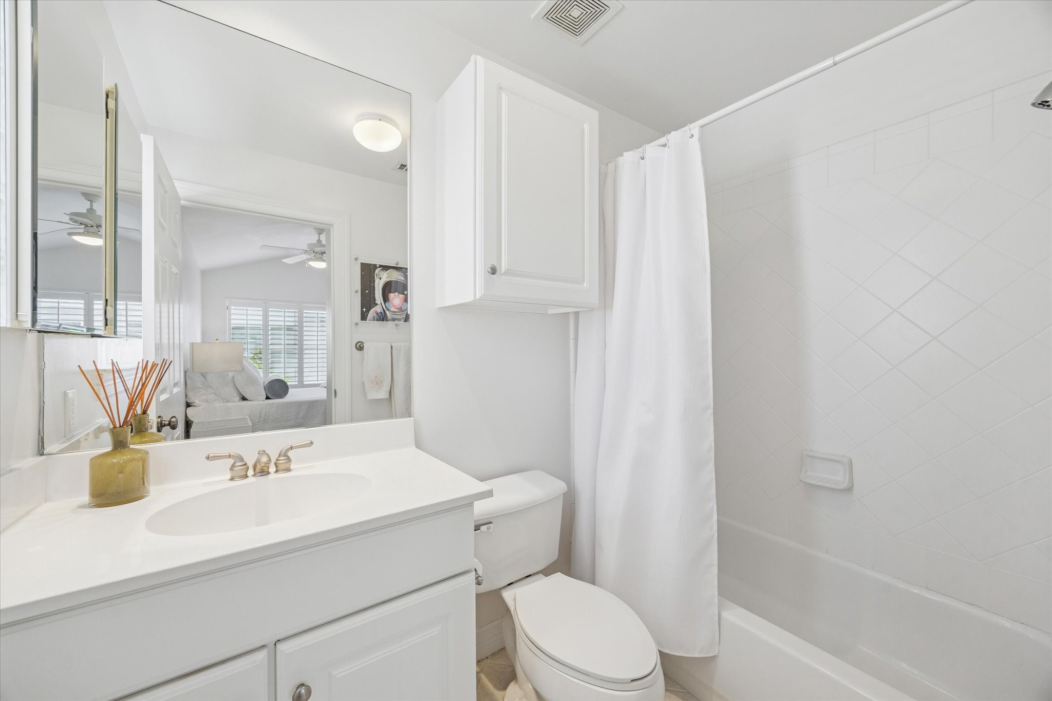 2700 Wroxton Road West University Place, TX 77005 - Photo 19 of 32 a bathroom with a sink a toilet and shower