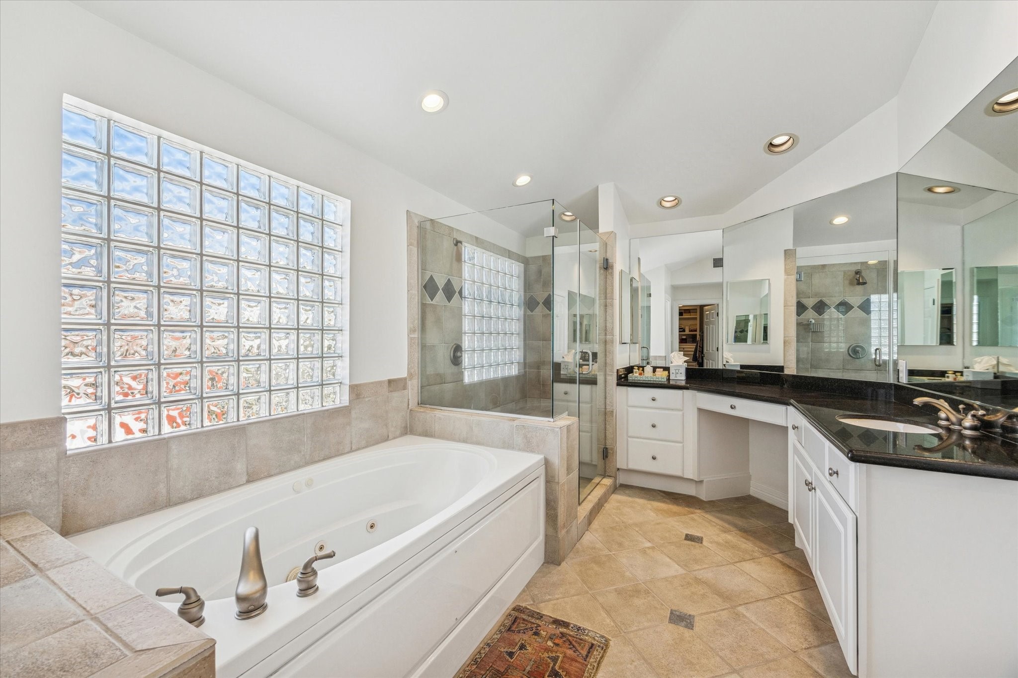 2700 Wroxton Road West University Place, TX 77005 - Photo 23 of 32 a large bathroom with a large tub sink and vanity