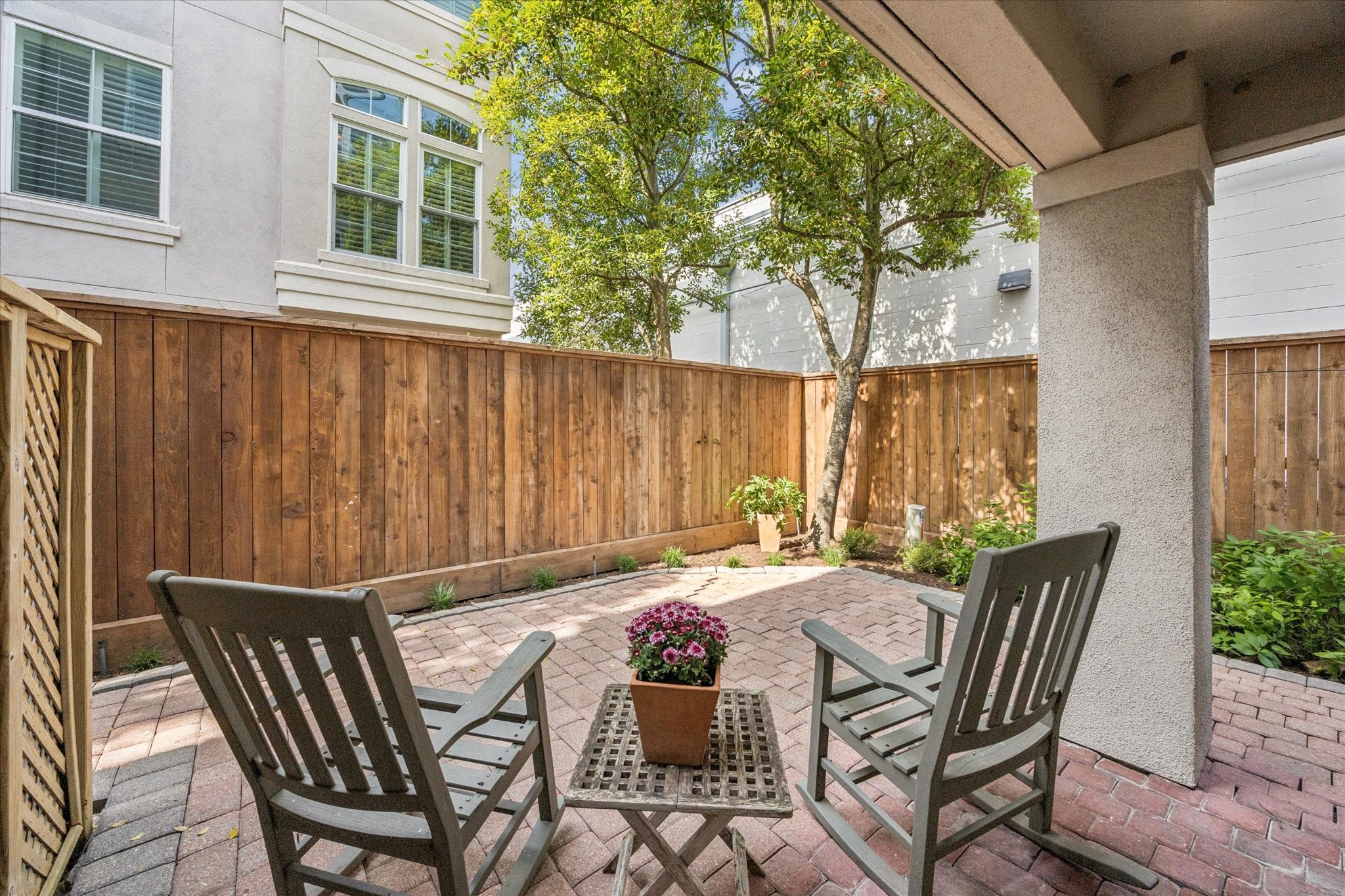 2700 Wroxton Road West University Place, TX 77005 - Photo 24 of 32 a view of a patio with table and chairs and potted plants