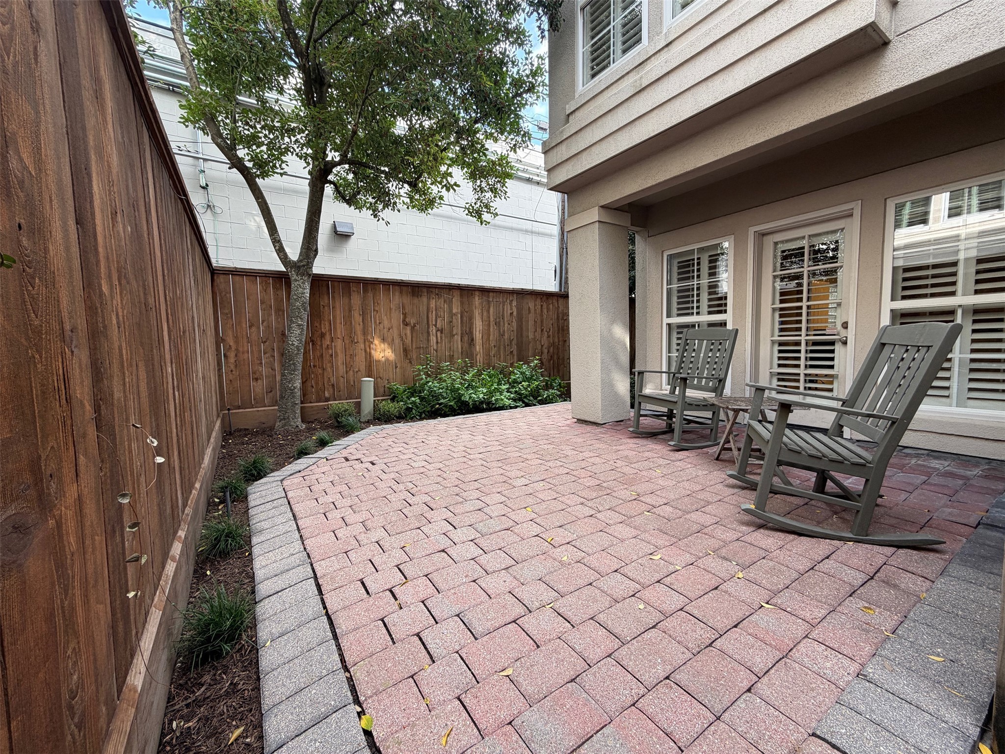 2700 Wroxton Road West University Place, TX 77005 - Photo 29 of 32 a backyard of a house with outdoor seating