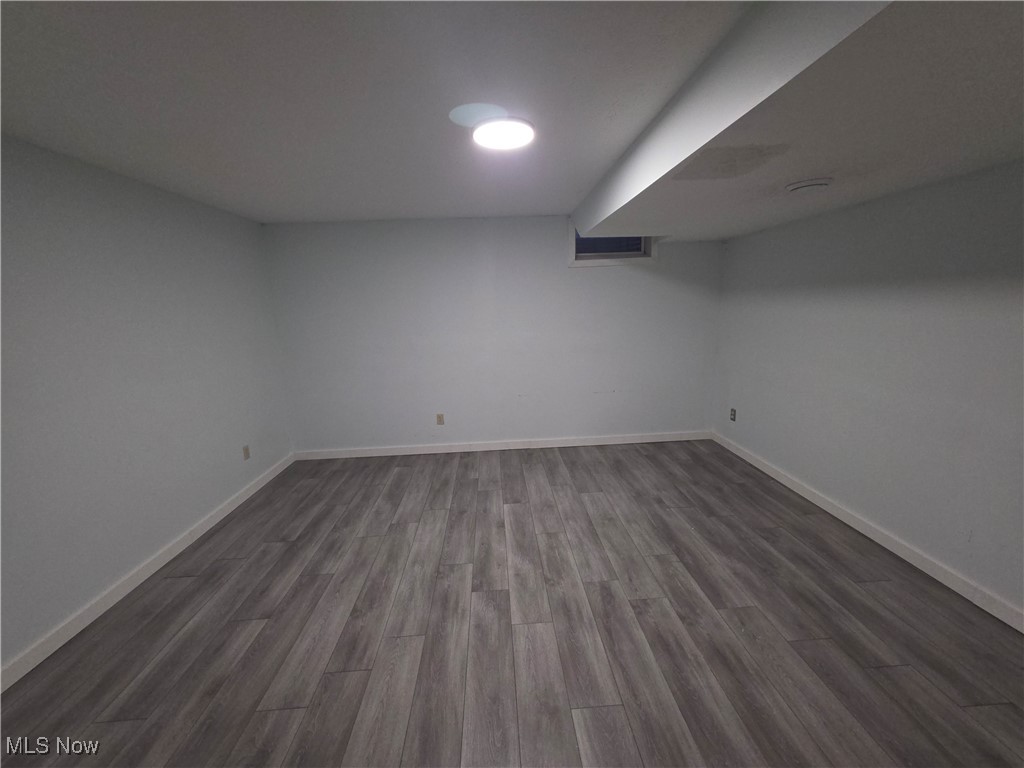 2291 Armstrong Road Wooster, OH 44691 - Photo 18 of 23 Finished basement bonus room featuring dark wood-vinyl flooring and baseboards