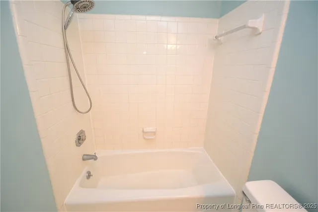 a bathroom with a sink toilet and mirror