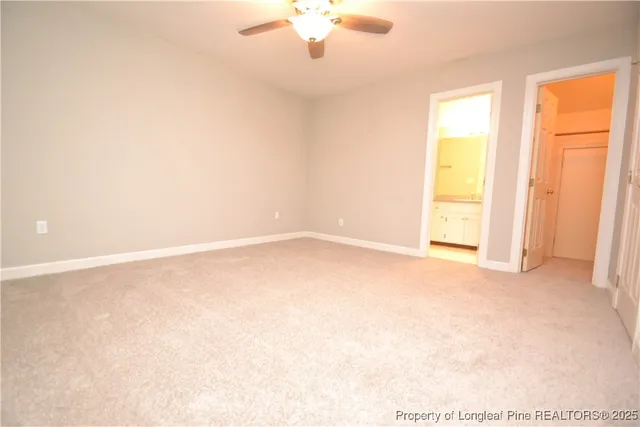 a bathroom with a shower and a glass door