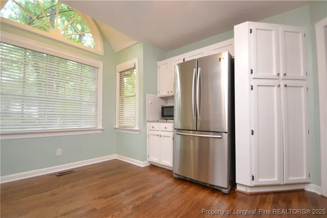 a white refrigerator freezer sitting inside of a kitchen