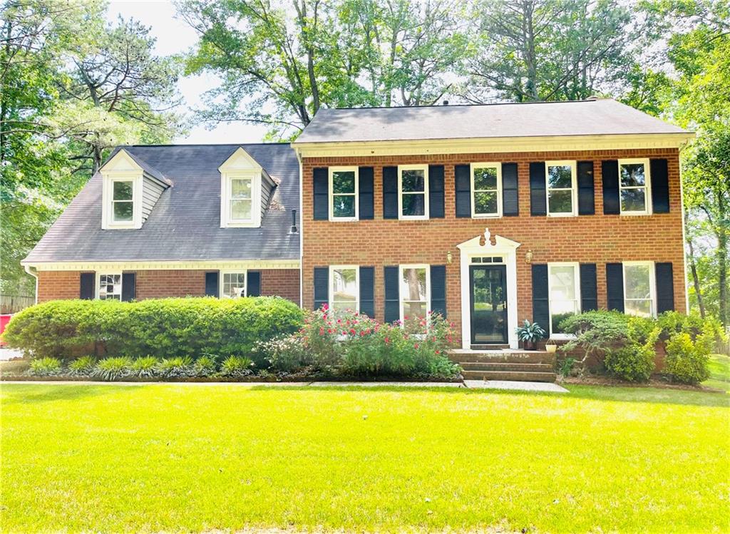 293 Patterson Road Southwest Lawrenceville, GA 30044 - Photo 1 of 1 a aerial view of a brick house with a large pool and large trees