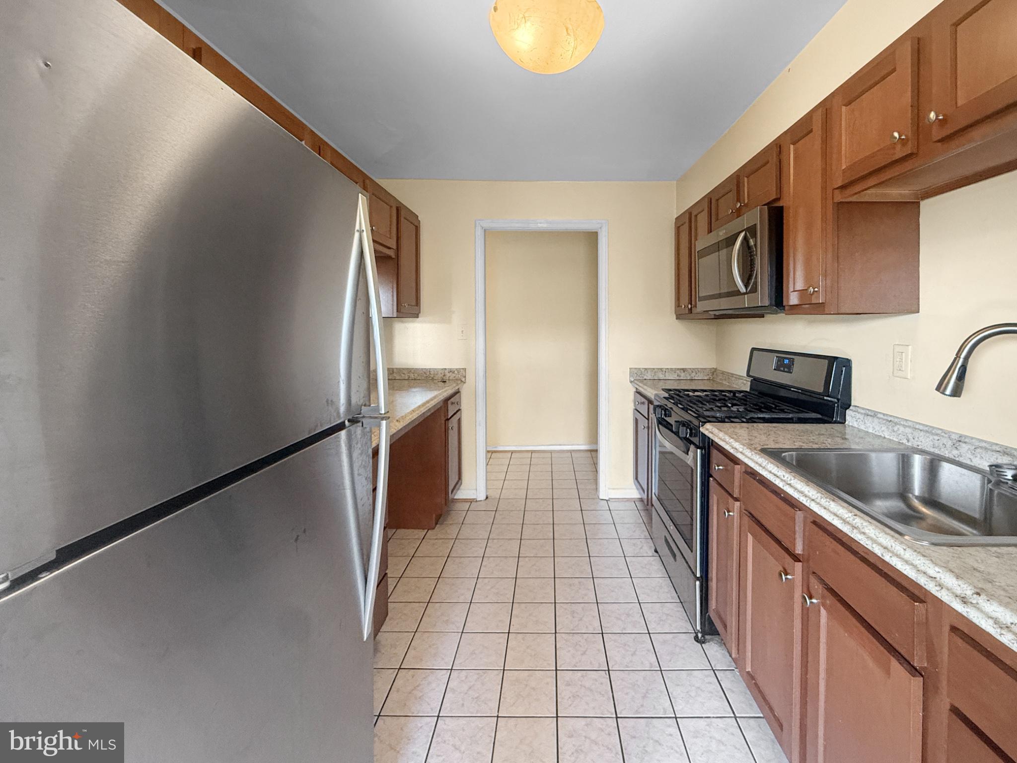 3807 St Barnabas Road, Unit 203 Suitland, MD 20746 - Photo 5 of 23 Modern kitchen with sleek finishes.