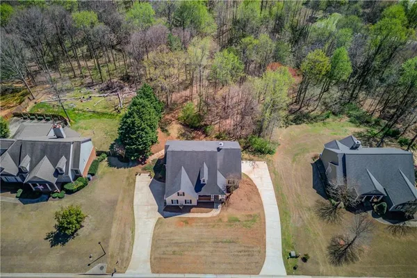 an aerial view of a house with outdoor space
