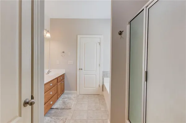 a view of bathroom with a sink and a mirror
