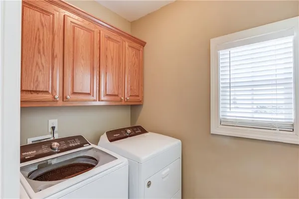 a view of storage and utility room with washer and dryer