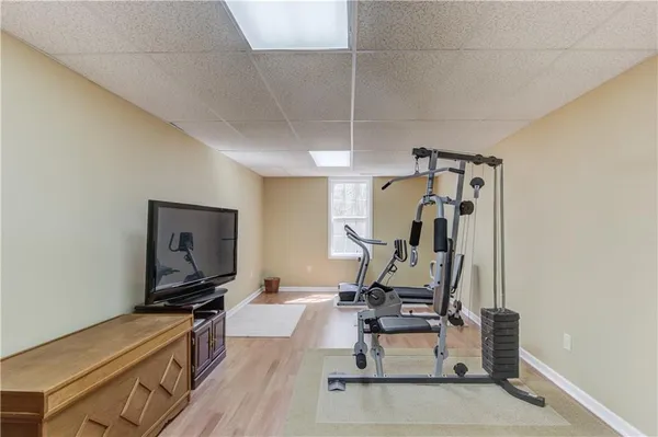 a room with furniture and gym equipment