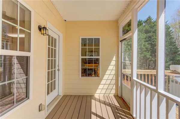 a view of a balcony with wooden floor