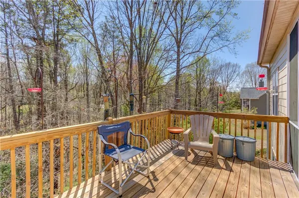 a view of balcony with furniture
