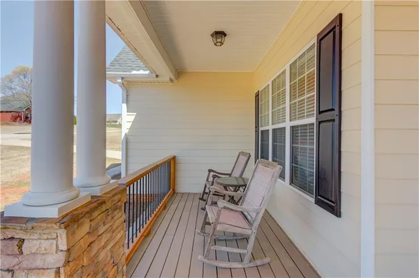 a view of balcony with furniture