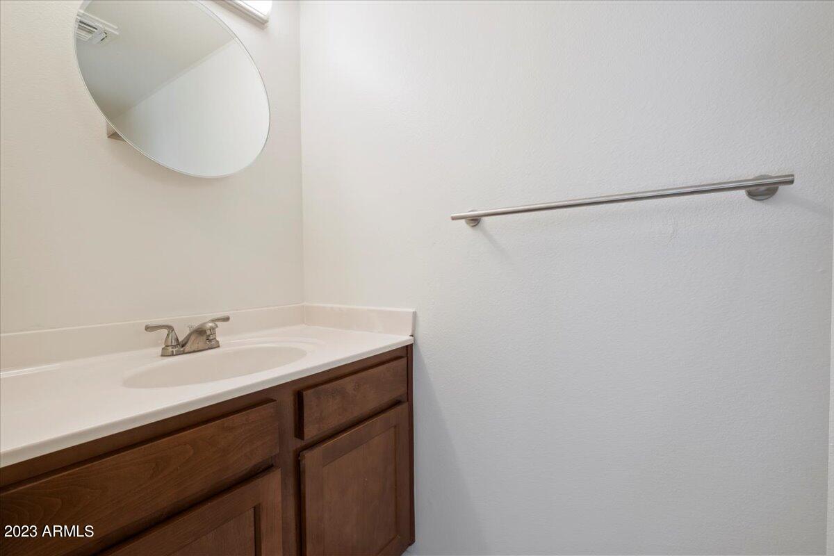 2524 South El Paradiso, Unit 50 Mesa, AZ 85202 - Photo 12 of 36 a bathroom with a sink and a mirror