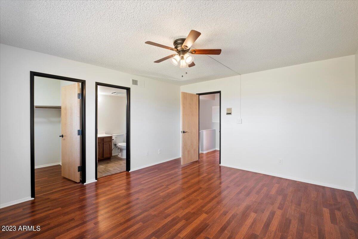 2524 South El Paradiso, Unit 50 Mesa, AZ 85202 - Photo 14 of 36 a view of an empty room with wooden floor