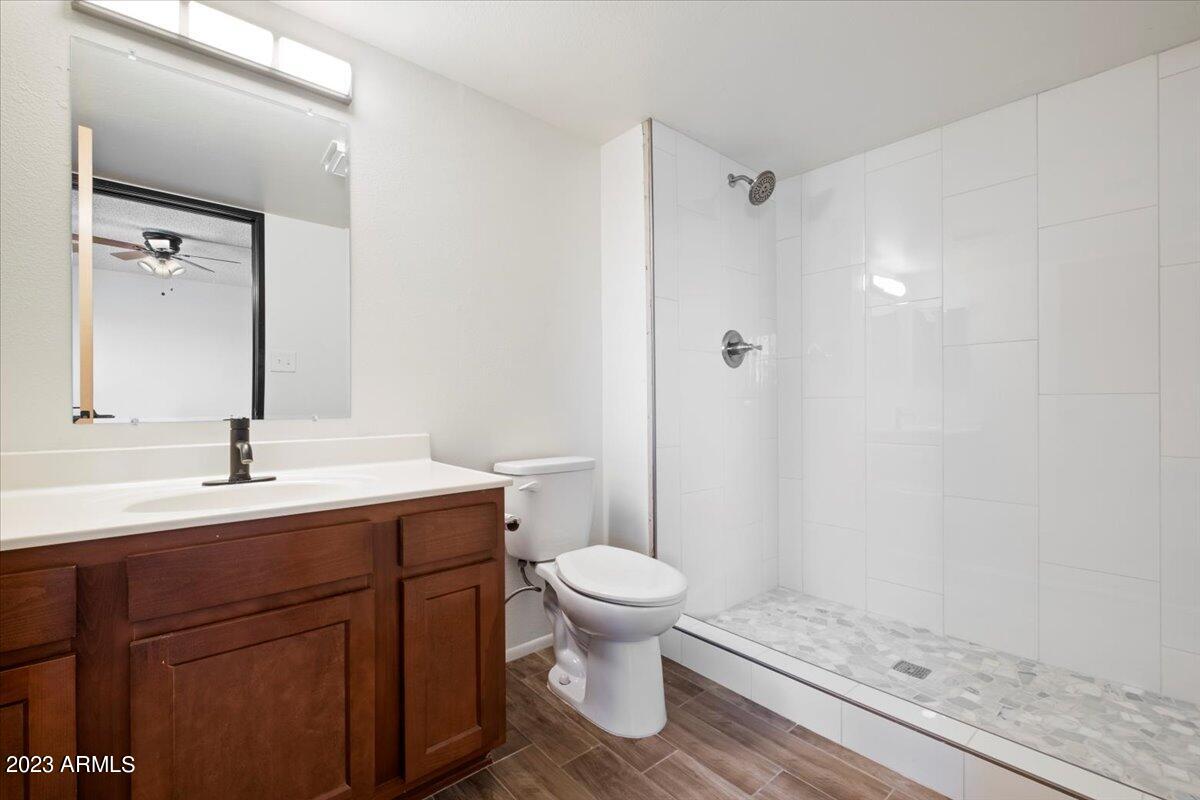 2524 South El Paradiso, Unit 50 Mesa, AZ 85202 - Photo 15 of 36 a bathroom with a sink toilet and shower