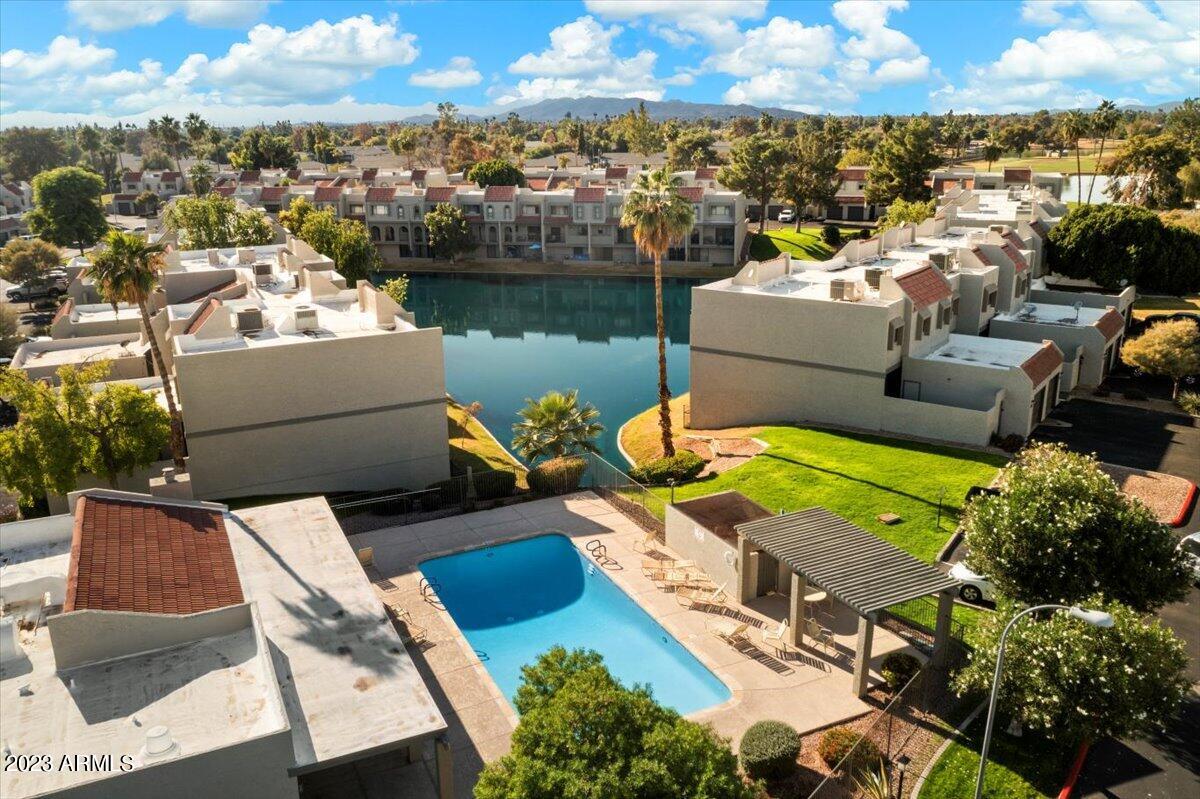 2524 South El Paradiso, Unit 50 Mesa, AZ 85202 - Photo 28 of 36 an aerial view of a house with swimming pool and ocean view