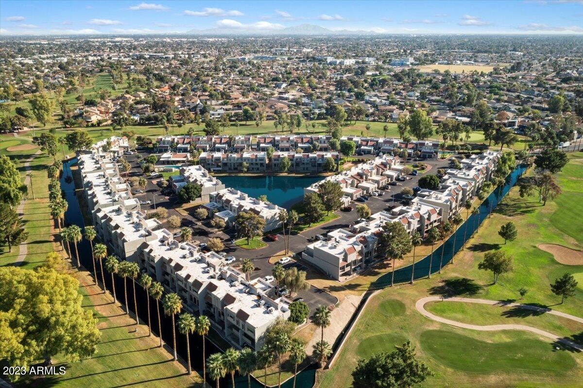 2524 South El Paradiso, Unit 50 Mesa, AZ 85202 - Photo 30 of 36 an aerial view of residential houses with outdoor space